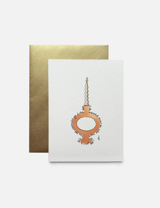 Christelijke kerstkaart A6 met illustratie van een kandelaar en Bijbeltekst uit Johannes 1:9, gedrukt op stijlvol papier.