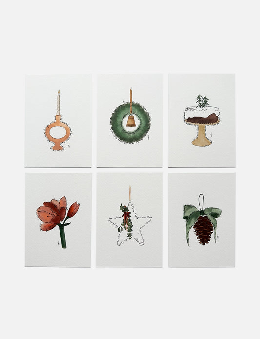 Handgemaakte christelijke kerstkaarten met illustraties in warme wintertinten en Engelse en Nederlandse bijbelteksten.